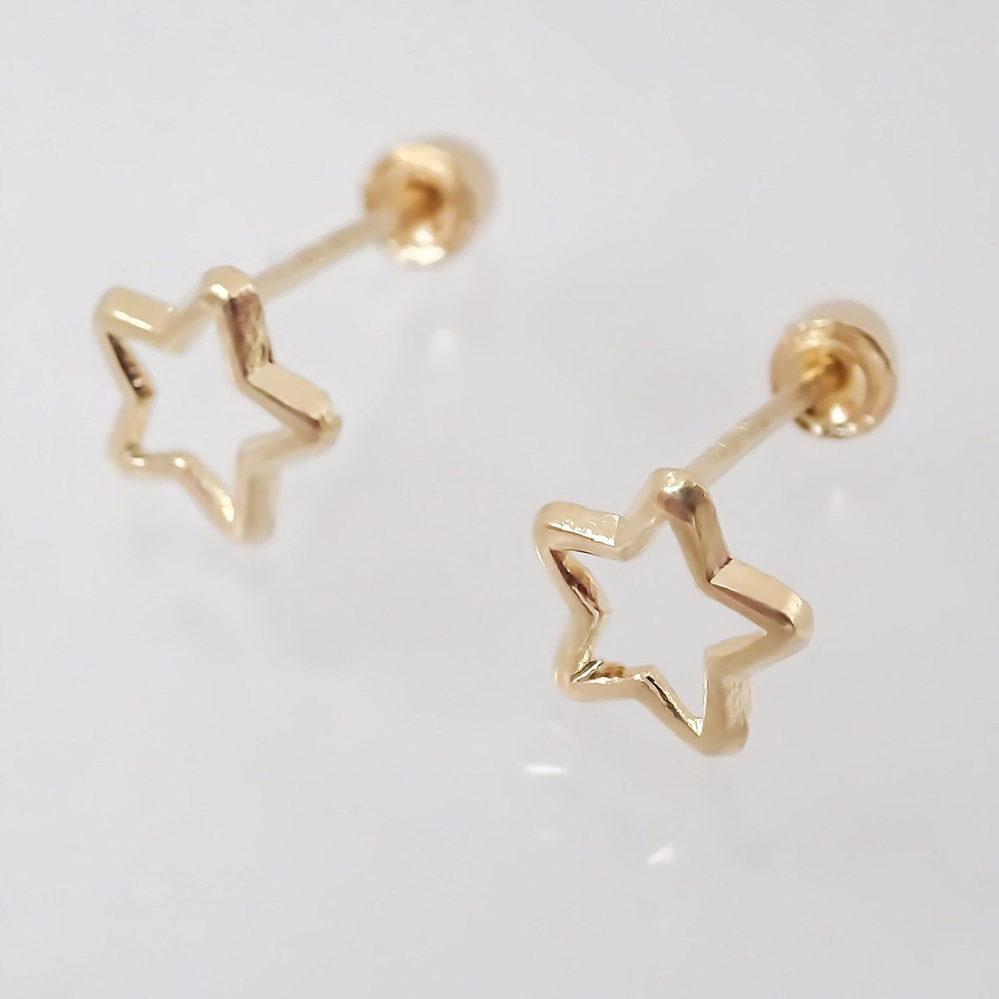 Amor Eterno - Broqueles Estrella Silueta / Aretes / Oro 10k