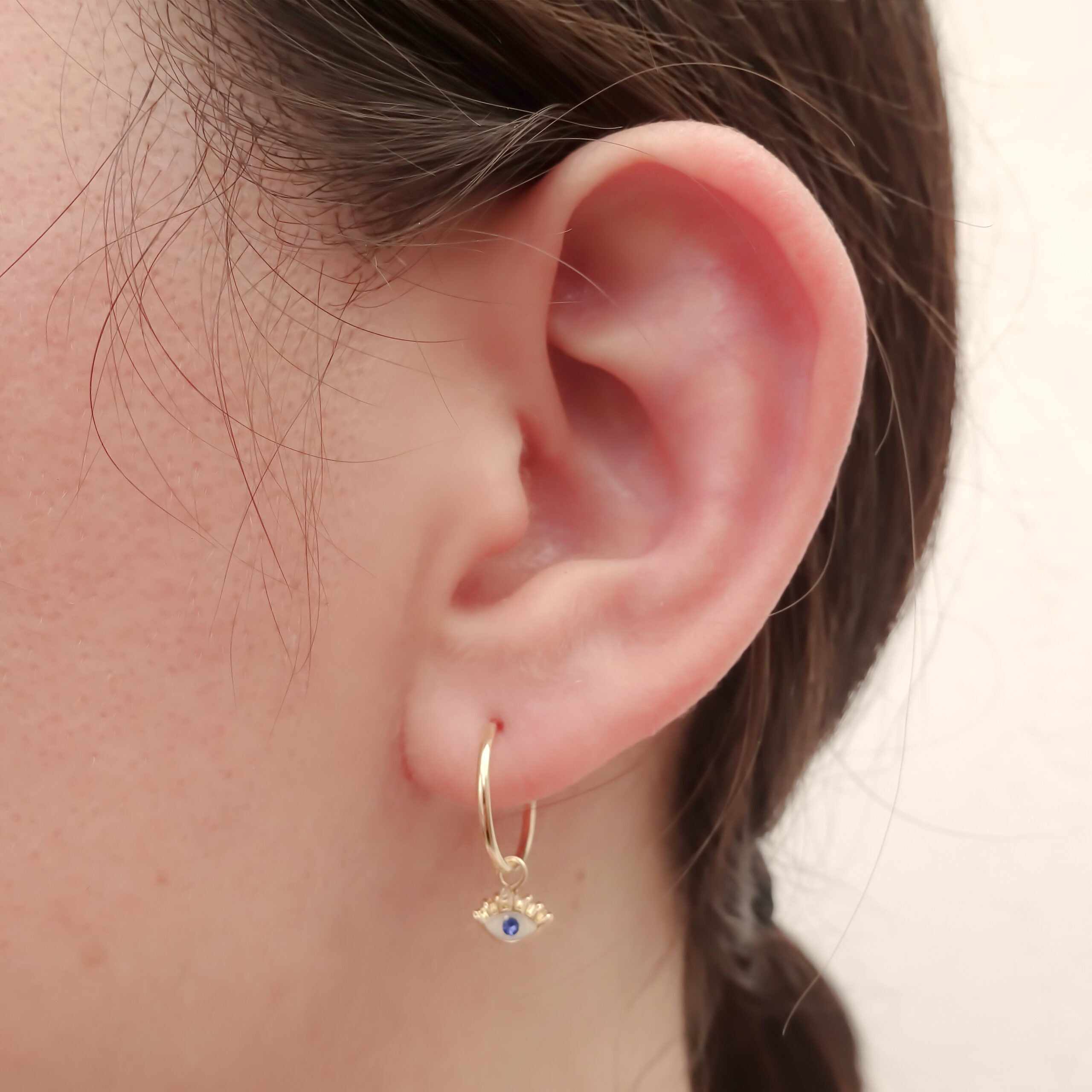 Dije con arracada Ojo Turco Oro amarillo 10k.