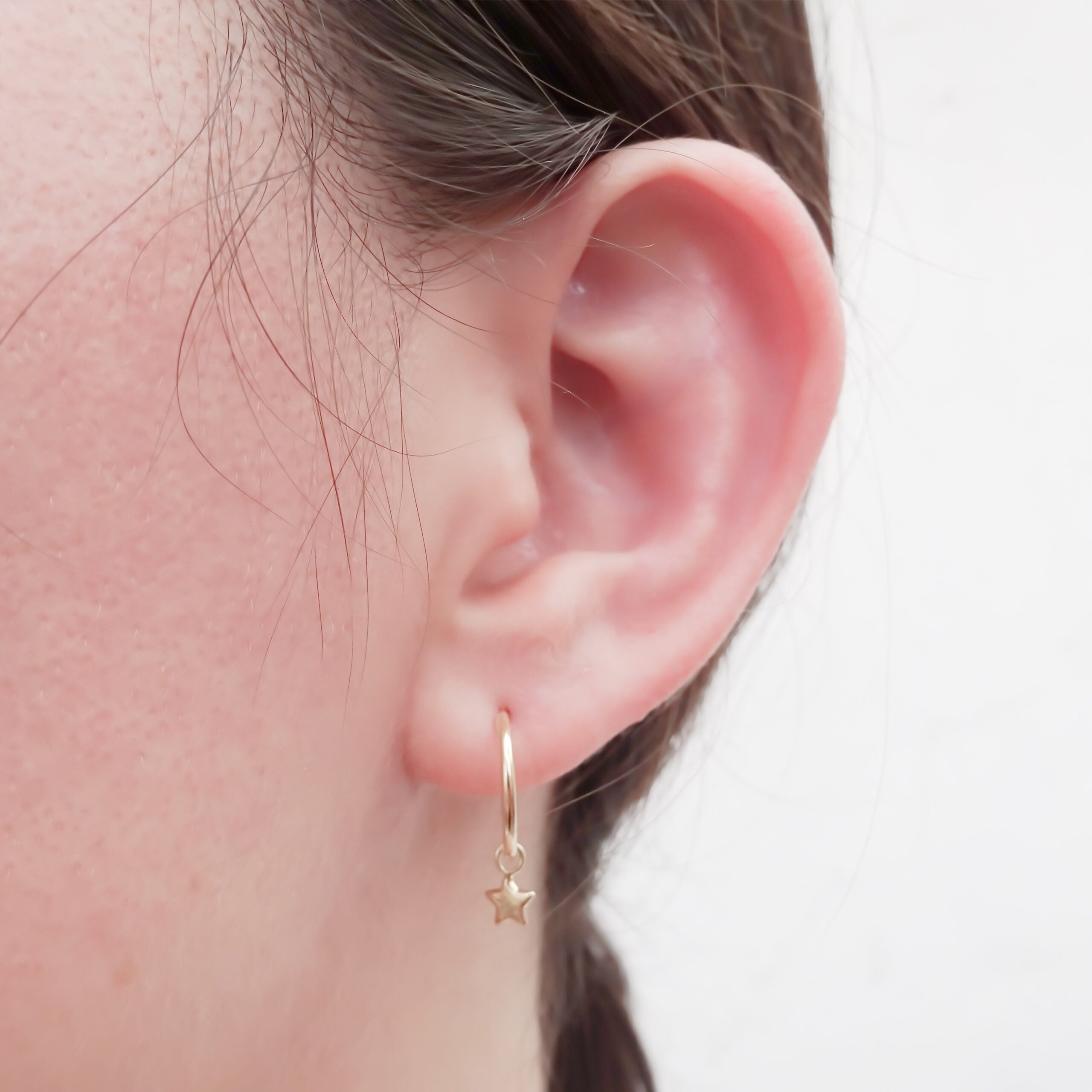 Dije arracada Estrella Oro 10k.