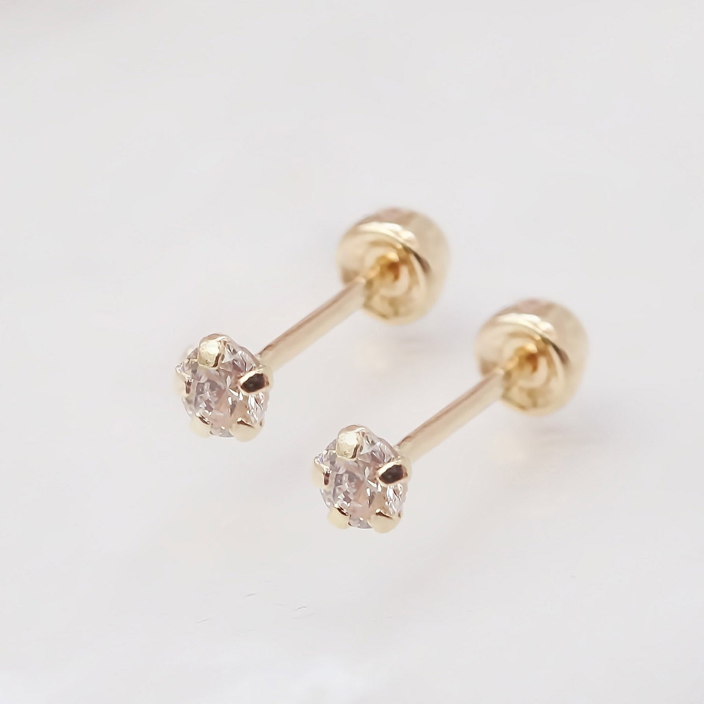 Amor Eterno - Broqueles Recto Mini Bebé / Aretes / Oro 10k / Transparente