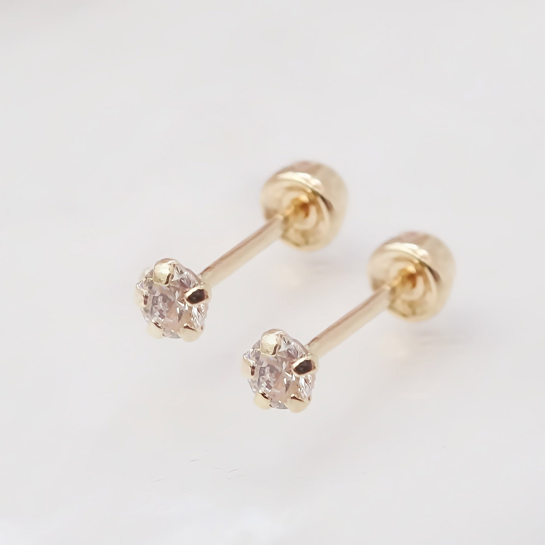 Amor Eterno - Broqueles Recto Mini Bebé / Aretes / Oro 10k / Transparente